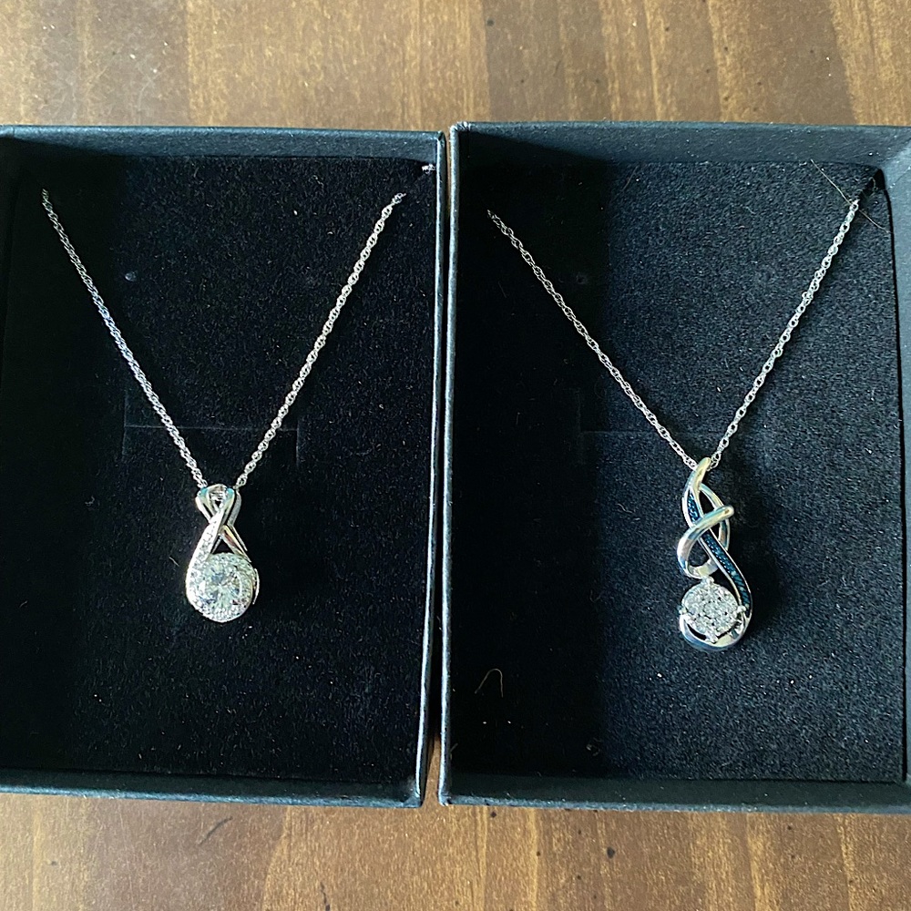 Brand new Kay Jewelers necklaces. One has sapphire on it